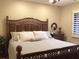 This spacious bedroom features a wooden bed frame, ceiling fan, and plantation shutters at 120 1St E St # 104, St Petersburg, FL 33715