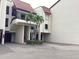 This condominium building features a Spanish-style roof and well-maintained landscaping at 120 1St E St # 104, St Petersburg, FL 33715