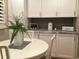 Bright dining nook featuring a round table, white chairs, and custom decor at 120 1St E St # 104, St Petersburg, FL 33715