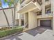 Inviting condo complex exterior with stairs and well-kept landscaping at 120 1St E St # 104, St Petersburg, FL 33715