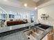 Modern kitchen featuring sleek granite countertops and stylish double basin sink at 120 1St E St # 104, St Petersburg, FL 33715