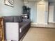 Living room featuring a gray sofa with neutral colored carpet and decorative accents at 120 1St E St # 104, St Petersburg, FL 33715