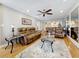 Living room with two leather couches, area rug, and wood floors at 120 1St E St # 104, St Petersburg, FL 33715
