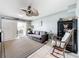 Open living room area featuring a sleeper sofa, rocking chair, and tile floors at 120 1St E St # 104, St Petersburg, FL 33715