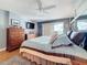 Comfortable main bedroom with TV, lots of windows and hardwood flooring at 120 1St E St # 104, St Petersburg, FL 33715