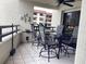 Enclosed patio with multiple seating areas and views of the building at 120 1St E St # 104, St Petersburg, FL 33715