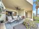 Relaxing outdoor patio with comfortable seating, ceiling fan, and waterfront views at 120 1St E St # 104, St Petersburg, FL 33715