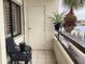 Outdoor patio featuring a black table and chair with planters at 120 1St E St # 104, St Petersburg, FL 33715