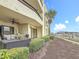Outdoor patio area with a view of the marina and access to green space at 120 1St E St # 104, St Petersburg, FL 33715