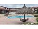 Community pool area featuring shaded seating, a hot tub, and ample space for lounging at 120 1St E St # 104, St Petersburg, FL 33715