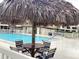 Relaxing pool area with a shaded table and chairs, plus a hot tub for ultimate leisure at 120 1St E St # 104, St Petersburg, FL 33715