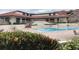 Large community pool and patio with clubhouse in the background at 120 1St E St # 104, St Petersburg, FL 33715