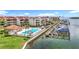 Community pool and boat docks with waterfront condos create an enticing view at 120 1St E St # 104, St Petersburg, FL 33715