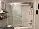 Bright bathroom showcasing white tiled walls and a clear glass shower enclosure at 120 1St E St # 104, St Petersburg, FL 33715