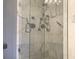 Updated shower with clear glass door and marble tile, creating a spa-like feel at 120 1St E St # 104, St Petersburg, FL 33715