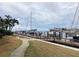 Waterfront scene with a scenic walkway alongside private boat docks amidst lush landscaping at 120 1St E St # 104, St Petersburg, FL 33715