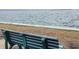 Bench overlooking calm waters, perfect for relaxation and enjoying the peaceful scenery at 120 1St E St # 104, St Petersburg, FL 33715