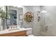 Modern bathroom showcasing sleek vanity, stylish decor, and walk-in shower with glass enclosure at 1759 Longliner Loop, Wesley Chapel, FL 33543