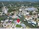 Aerial view of waterfront homes with pool and boat dock on a canal at 1769 Brookside Blvd, Largo, FL 33770