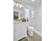 Bright bathroom with white cabinets, updated shower, and stylish fixtures creates a clean modern look at 1769 Brookside Blvd, Largo, FL 33770