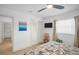Sunlit bedroom featuring a window view, closet, and calming decor, creating a cozy atmosphere at 1769 Brookside Blvd, Largo, FL 33770