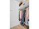 Organized closet with clothes, shoes, and storage shelves for optimal space and organization at 1769 Brookside Blvd, Largo, FL 33770