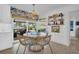 Cozy dining area featuring stylish decor and a view of the pool, adjacent to the kitchen, great for gatherings at 1769 Brookside Blvd, Largo, FL 33770