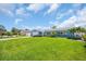 Charming blue exterior with landscaped front yard, lawn, and two-car garage at 1769 Brookside Blvd, Largo, FL 33770