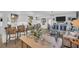 Open concept living room with modern furnishings and decor, seamlessly connecting to a contemporary kitchen, perfect for entertaining at 1769 Brookside Blvd, Largo, FL 33770