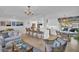 Inviting living area with a seamless layout connecting the living room, dining area, and modern kitchen for entertaining at 1769 Brookside Blvd, Largo, FL 33770