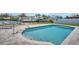 Inviting in-ground pool with easy access via steps, surrounded by a paved patio, perfect for cooling off on warm days at 1769 Brookside Blvd, Largo, FL 33770
