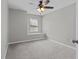 This bedroom features carpet, a ceiling fan and a built-in window seat at 1948 Grenville Ct, Wesley Chapel, FL 33543