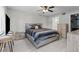 Cozy bedroom with ceiling fan, walk-in closet and ensuite bath at 1948 Grenville Ct, Wesley Chapel, FL 33543