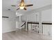 Spacious living room showcasing the open floor plan and staircase at 1948 Grenville Ct, Wesley Chapel, FL 33543