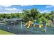 Community playground featuring colorful slides, swings, and covered picnic areas for outdoor fun at 1948 Grenville Ct, Wesley Chapel, FL 33543