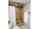 Bathroom featuring a tiled shower with a white shower curtain at 2012 Scotland Dr, Clearwater, FL 33763