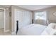 Cozy bedroom featuring a large closet and a sunlit window dressed with sheer curtains at 2012 Scotland Dr, Clearwater, FL 33763