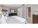 Cozy bedroom with a spacious view to the dining room and neutral color scheme at 2012 Scotland Dr, Clearwater, FL 33763