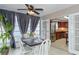 Bright sunroom dining area connects seamlessly to the kitchen through elegant French doors at 2012 Scotland Dr, Clearwater, FL 33763