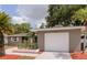Charming single-story home with a well-maintained exterior and attached garage at 2012 Scotland Dr, Clearwater, FL 33763