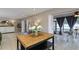 Spacious interior featuring a kitchen with island opening to flexible living spaces and dining area at 2012 Scotland Dr, Clearwater, FL 33763