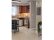 The kitchen features tile flooring, stainless steel appliances, and an inspiring message at 2012 Scotland Dr, Clearwater, FL 33763