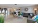 Bright and spacious living room with a comfortable sectional sofa and stylish decor at 2012 Scotland Dr, Clearwater, FL 33763