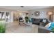 Inviting living room featuring a large sectional sofa, neutral colors, and an open floor plan at 2012 Scotland Dr, Clearwater, FL 33763