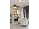 Cozy living room with a comfortable white chair and stylish decor, leading into the bedroom at 2012 Scotland Dr, Clearwater, FL 33763