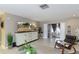 Open-concept living room boasts neutral tones, an entertainment center, and a relaxed seating arrangement at 2012 Scotland Dr, Clearwater, FL 33763