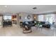 Spacious living room with an open floor plan, blending seamlessly with the kitchen area for easy entertaining at 2012 Scotland Dr, Clearwater, FL 33763