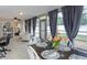 Bright sunroom offers a versatile space with comfortable seating and a dining area at 2012 Scotland Dr, Clearwater, FL 33763