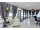 Sunroom features a comfortable seating area, dining space, and dedicated work area at 2012 Scotland Dr, Clearwater, FL 33763