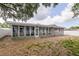 Enclosed sunroom provides a tranquil space with lots of natural light at 2012 Scotland Dr, Clearwater, FL 33763